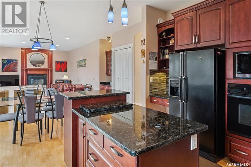 621 Brookhurst Court, Saskatoon, SK - Indoor Photo Showing Kitchen With Fireplace