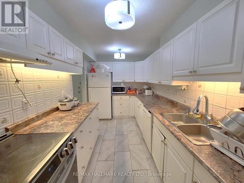 206 - 10 Tobermory Drive, Toronto, ON - Indoor Photo Showing Kitchen With Double Sink