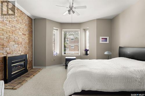 204 2925 14Th Avenue, Regina, SK - Indoor Photo Showing Bedroom With Fireplace