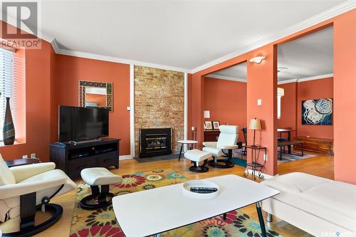 204 2925 14Th Avenue, Regina, SK - Indoor Photo Showing Living Room With Fireplace