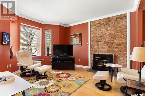 204 2925 14Th Avenue, Regina, SK - Indoor Photo Showing Living Room With Fireplace