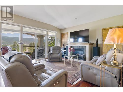 2259 Capistrano Drive, Kelowna, BC - Indoor Photo Showing Living Room With Fireplace