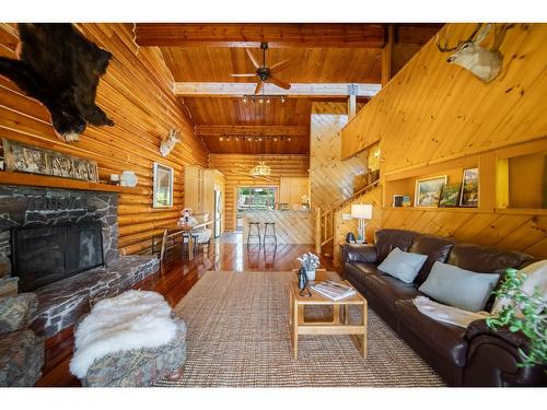 6275 Tie Lake Shore Road N, Jaffray, BC - Indoor Photo Showing Living Room With Fireplace