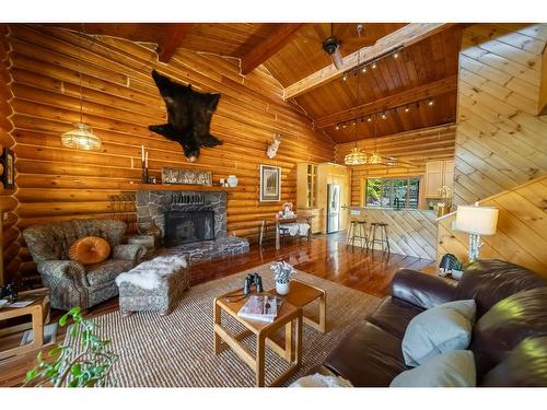 6275 Tie Lake Shore Road N, Jaffray, BC - Indoor Photo Showing Living Room With Fireplace