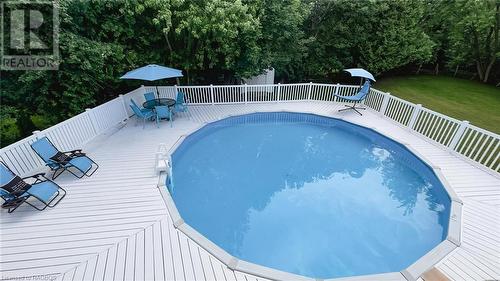 Above ground pool with fenced in deck and pool house - 202 Birchwood Avenue, Kincardine Twp, ON - Outdoor With Above Ground Pool