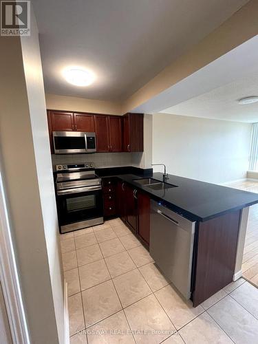 502 - 4879 Kimbermount Avenue, Mississauga, ON - Indoor Photo Showing Kitchen With Double Sink