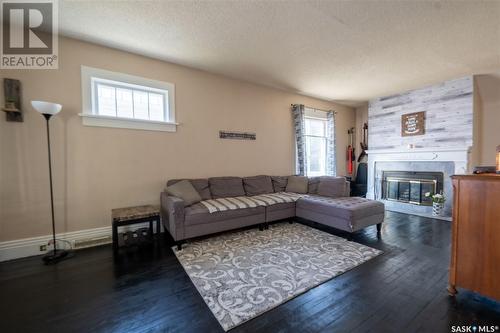 1090 1St Avenue Ne, Moose Jaw, SK - Indoor Photo Showing Living Room With Fireplace
