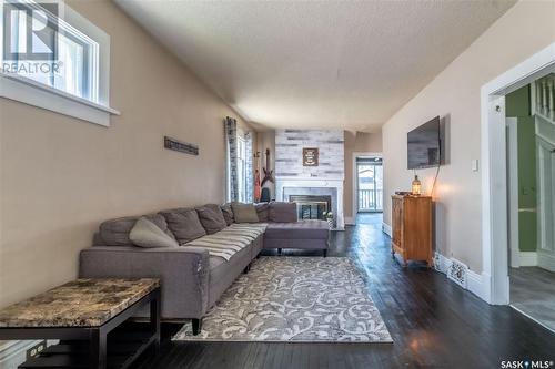 1090 1St Avenue Ne, Moose Jaw, SK - Indoor Photo Showing Living Room With Fireplace