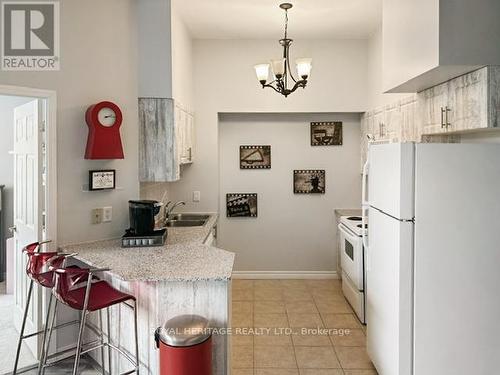 107 - 1730 Eglinton Avenue E, Toronto, ON - Indoor Photo Showing Kitchen With Double Sink