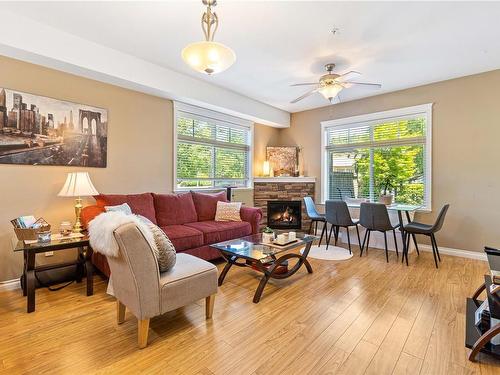 101-2115 Meredith Rd, Nanaimo, BC - Indoor Photo Showing Living Room With Fireplace