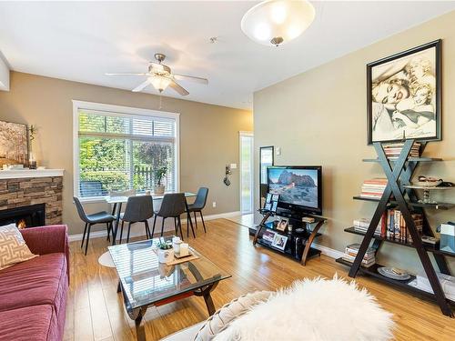 101-2115 Meredith Rd, Nanaimo, BC - Indoor Photo Showing Living Room With Fireplace