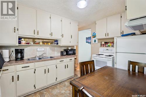 701 7Th Street E, Prince Albert, SK - Indoor Photo Showing Kitchen With Double Sink