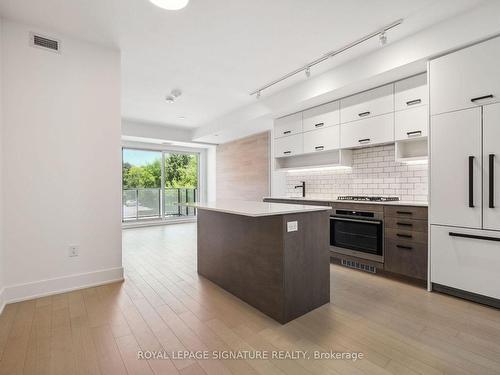 309-1888 Queen St E, Toronto, ON - Indoor Photo Showing Kitchen With Upgraded Kitchen