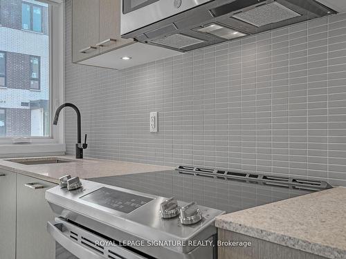 Th5-30 Ed Clark Gdns, Toronto, ON - Indoor Photo Showing Kitchen With Upgraded Kitchen