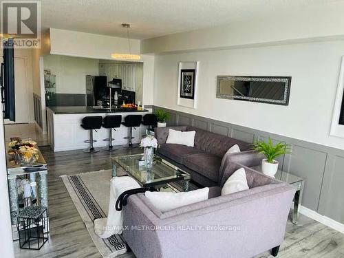 1011 - 410 Mclevin Avenue, Toronto, ON - Indoor Photo Showing Living Room