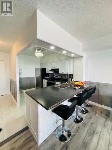 1011 - 410 Mclevin Avenue, Toronto, ON - Indoor Photo Showing Kitchen With Double Sink