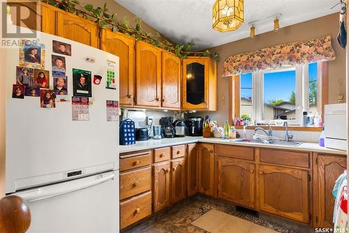 3031 Ford Street E, Regina, SK - Indoor Photo Showing Kitchen With Double Sink