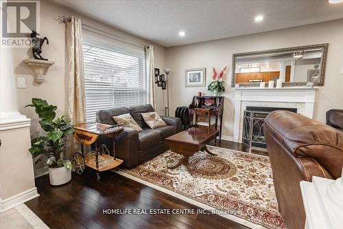 48 Prince Of Wales Drive, Barrie, ON - Indoor Photo Showing Living Room With Fireplace