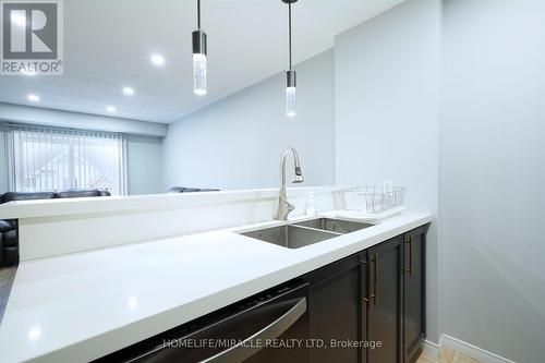 303 - 300 Spillsbury Drive, Peterborough, ON - Indoor Photo Showing Kitchen With Double Sink