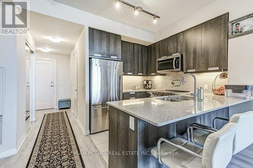 413 - 35 Watergarden Drive, Mississauga (Hurontario), ON - Indoor Photo Showing Kitchen With Stainless Steel Kitchen With Double Sink With Upgraded Kitchen