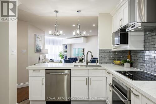 Ph214 - 120 Promenade Circle, Vaughan, ON - Indoor Photo Showing Kitchen With Double Sink With Upgraded Kitchen