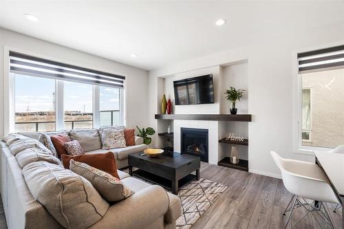 67 Larry Vickar Drive E, Winnipeg, MB - Indoor Photo Showing Living Room With Fireplace