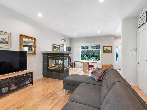 2-762 Sanctuary Crt, Saanich, BC - Indoor Photo Showing Living Room With Fireplace