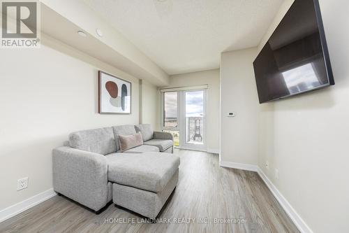 1310 - 38 Monte Kwinter Court, Toronto, ON - Indoor Photo Showing Living Room