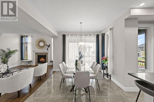 17 Tindall Crescent, East Luther Grand Valley, ON - Indoor Photo Showing Dining Room With Fireplace