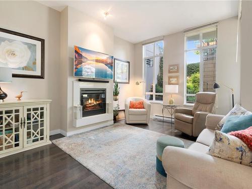 108-999 Burdett Ave, Victoria, BC - Indoor Photo Showing Living Room With Fireplace