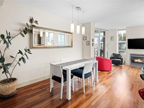 S1102-737 Humboldt St, Victoria, BC - Indoor Photo Showing Other Room With Fireplace