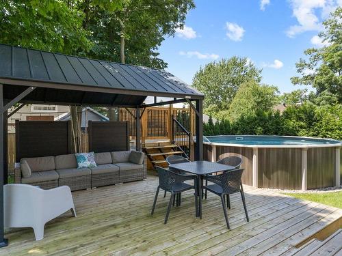 Cour - 671 Rue De L'Heure-Mauve, Mont-Saint-Hilaire, QC - Outdoor With Above Ground Pool With Deck Patio Veranda