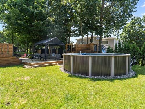 Cour - 671 Rue De L'Heure-Mauve, Mont-Saint-Hilaire, QC - Outdoor With Above Ground Pool With Backyard