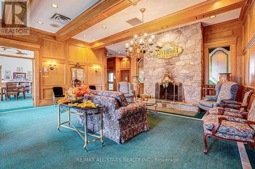 306 - 51 Rivermill Boulevard, Kawartha Lakes (Lindsay), ON - Indoor Photo Showing Living Room With Fireplace