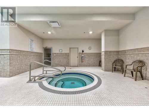 1128 Sunset Drive Unit# 1202, Kelowna, BC - Indoor Photo Showing Other Room With In Ground Pool