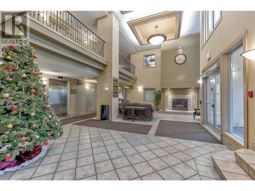 1128 Sunset Drive Unit# 1202, Kelowna, BC - Indoor Photo Showing Other Room With Fireplace