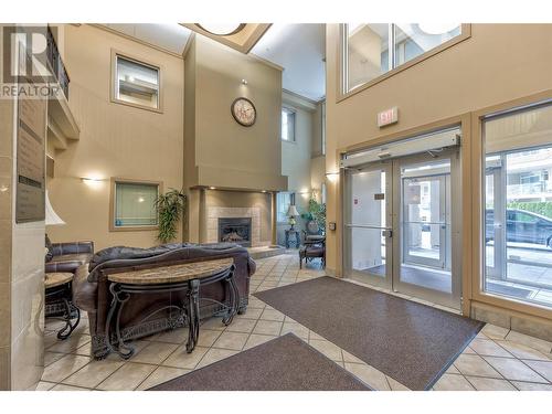 1128 Sunset Drive Unit# 1202, Kelowna, BC - Indoor Photo Showing Other Room With Fireplace