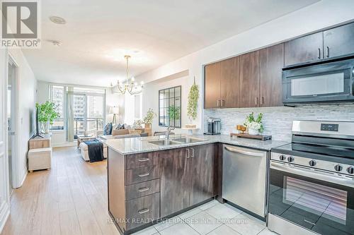 715 - 55 De Boers Drive, Toronto, ON - Indoor Photo Showing Kitchen With Stainless Steel Kitchen With Double Sink