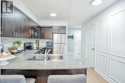 715 - 55 De Boers Drive, Toronto, ON - Indoor Photo Showing Kitchen With Double Sink