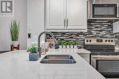 307 - 80 Port Street E, Mississauga, ON - Indoor Photo Showing Kitchen With Double Sink