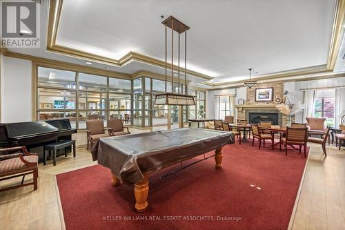 1215 - 100 Burloak Drive, Burlington, ON - Indoor Photo Showing Other Room With Fireplace