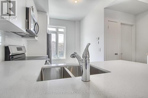 98 Bartley Drive, Toronto, ON - Indoor Photo Showing Kitchen With Double Sink