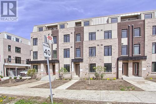 98 Bartley Drive, Toronto, ON - Outdoor With Facade