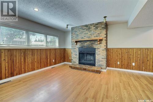 26 Hawkes Avenue, Regina, SK - Indoor Photo Showing Living Room With Fireplace