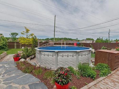 Cour - 1424 Rue Bellancourt, Mascouche, QC - Outdoor With Above Ground Pool With Backyard