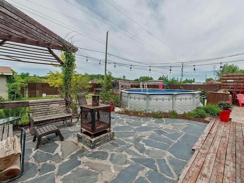 Cour - 1424 Rue Bellancourt, Mascouche, QC - Outdoor With Above Ground Pool