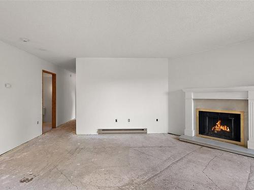 306-75 Gorge Rd West, Saanich, BC - Indoor Photo Showing Living Room With Fireplace