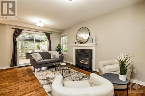 24 Mary Hill Crescent, Richmond, ON - Indoor Photo Showing Living Room With Fireplace