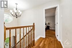 The gorgeous hardwood continues upstairs and in the primary bedroom. - 