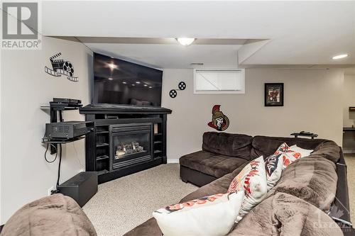 Cozy up for a movie infront of a second gas fireplace- perfect for the cold winter nights! - 24 Mary Hill Crescent, Richmond, ON - Indoor With Fireplace
